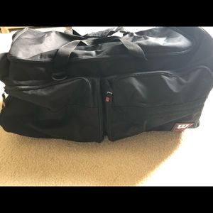 New condition Wilson Rolling duffle bag